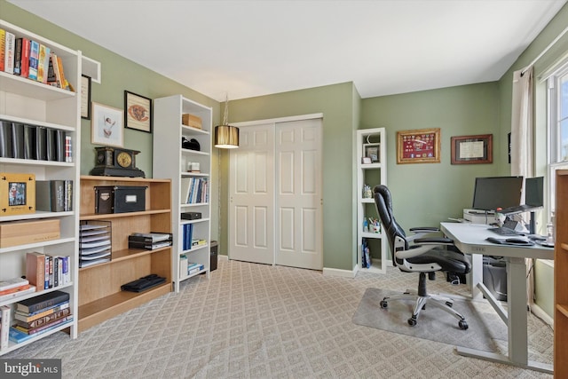 office area featuring baseboards and carpet