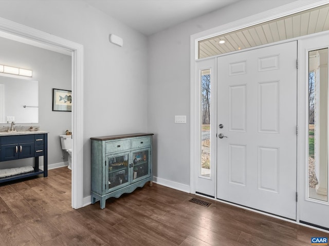 3185 Polecat Creek Ln, Scottsville, VA 24590 - entrance foyer featuring visible vents, baseboards, and dark wood finished floors