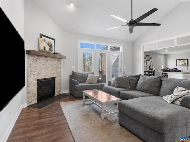 3185 Polecat Creek Ln, Scottsville, VA 24590 - living room with high vaulted ceiling, ceiling fan, a fireplace, baseboards, and dark wood-style flooring