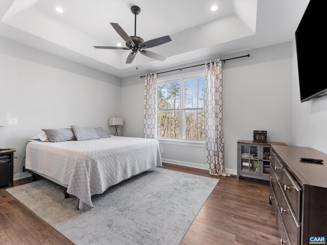 3185 Polecat Creek Ln, Scottsville, VA 24590 - bedroom with a tray ceiling, baseboards, recessed lighting, ceiling fan, and dark wood-type flooring