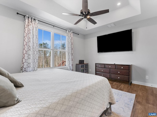 3185 Polecat Creek Ln, Scottsville, VA 24590 - bedroom featuring a tray ceiling, baseboards, recessed lighting, wood finished floors, and ceiling fan