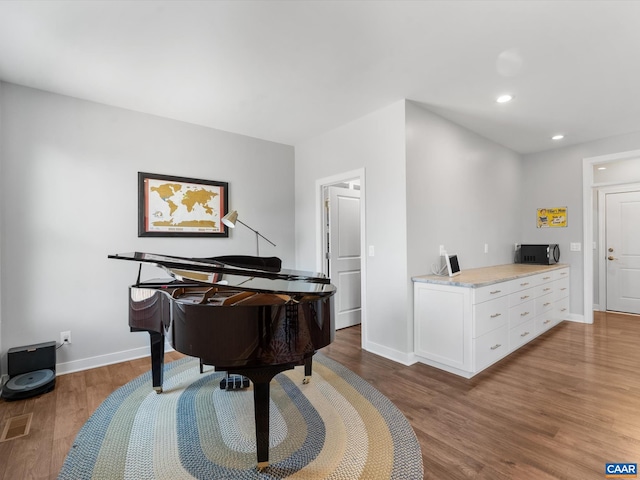 3185 Polecat Creek Ln, Scottsville, VA 24590 - living area featuring visible vents, baseboards, wood finished floors, and recessed lighting