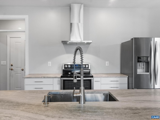 3185 Polecat Creek Ln, Scottsville, VA 24590 - kitchen with wall chimney exhaust hood, stainless steel appliances, light stone countertops, and white cabinetry