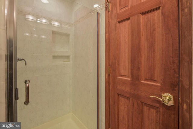 full bath featuring a shower stall