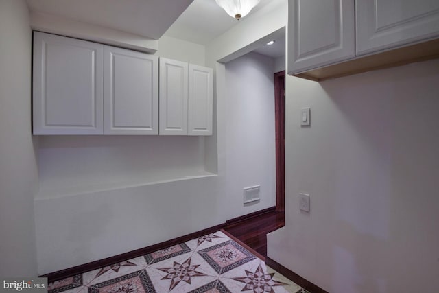 detailed view of wood finished floors and baseboards