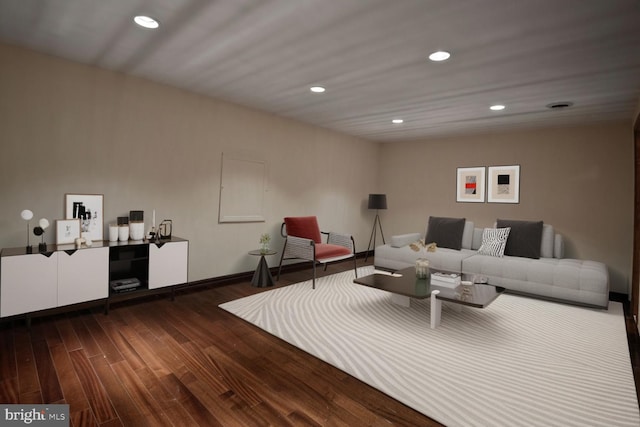 living area featuring wood finished floors, recessed lighting, and baseboards