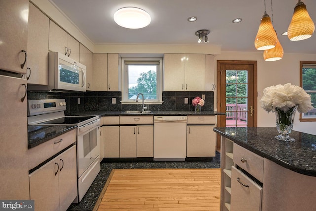 kitchen featuring white appliances, a sink, decorative backsplash, pendant lighting, and recessed lighting