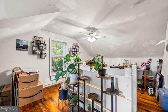 additional living space with ceiling fan, vaulted ceiling, and hardwood / wood-style floors