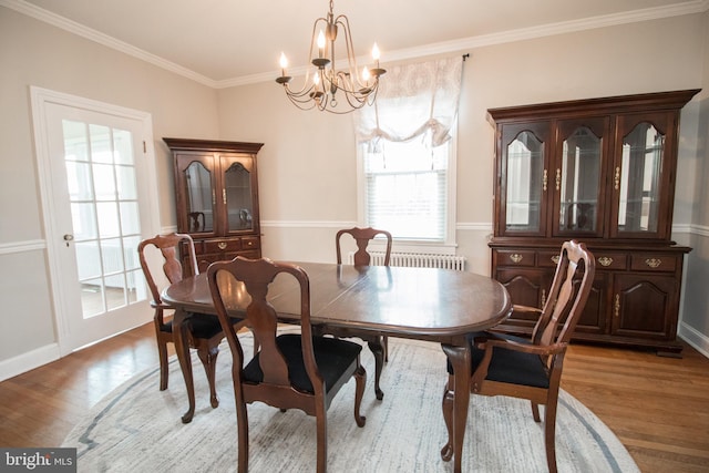 23075 Hollywood Rd, Leonardtown, MD 20650 - dining room featuring crown molding, light wood finished floors, baseboards, and a notable chandelier