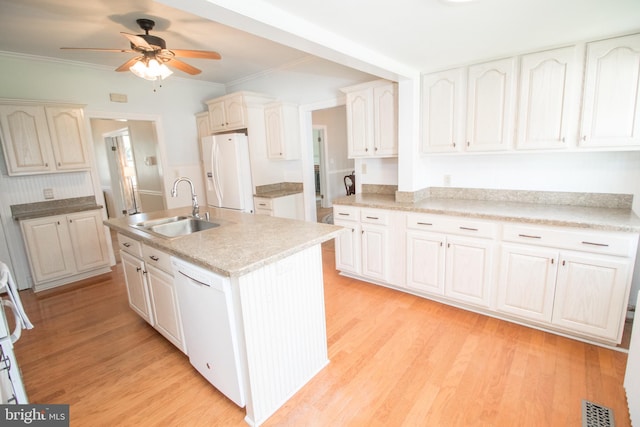 23075 Hollywood Rd, Leonardtown, MD 20650 - kitchen featuring an island with sink, a sink, white appliances, light wood-style flooring, and ceiling fan