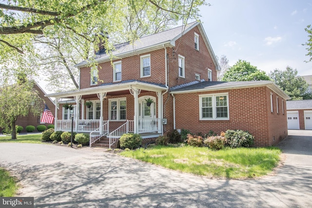 23075 Hollywood Rd, Leonardtown, MD 20650 - view of front facade featuring brick siding and a porch