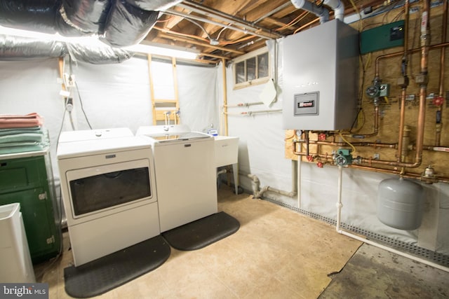 23075 Hollywood Rd, Leonardtown, MD 20650 - clothes washing area with separate washer and dryer, water heater, a sink, and laundry area
