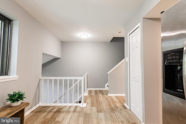 7374 Hickory Log Cir, Columbia, MD 21045 - corridor featuring wood finished floors, an upstairs landing, and baseboards