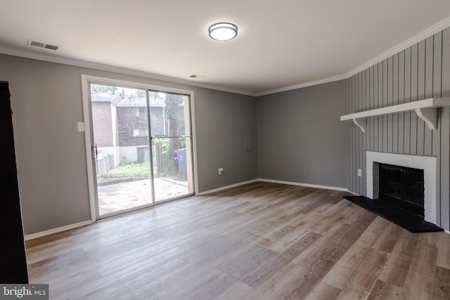 7374 Hickory Log Cir, Columbia, MD 21045 - unfurnished living room featuring wood finished floors, ornamental molding, a brick fireplace, and baseboards