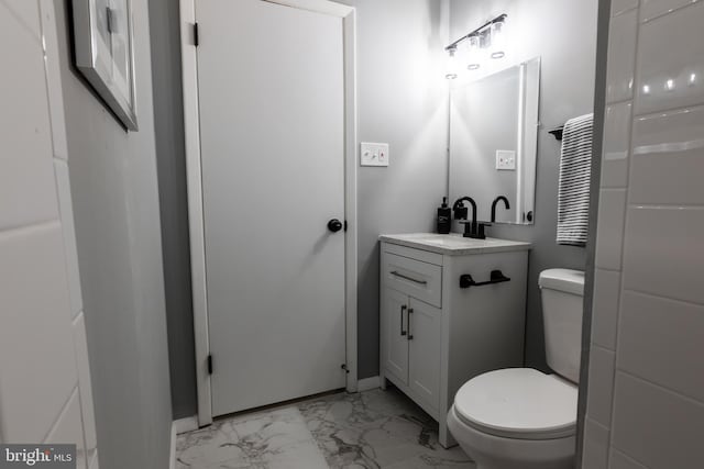 7374 Hickory Log Cir, Columbia, MD 21045 - bathroom with marble finish flooring, toilet, and vanity