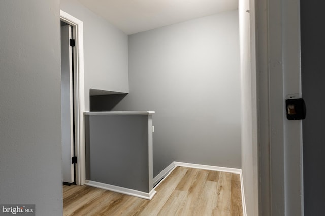 7374 Hickory Log Cir, Columbia, MD 21045 - hallway with wood finished floors, baseboards, and an upstairs landing