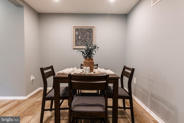 7374 Hickory Log Cir, Columbia, MD 21045 - dining area with light wood finished floors, baseboards, and recessed lighting
