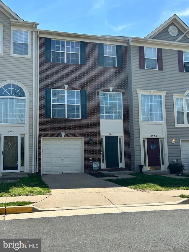 6733 Emmanuel Ct, Gainesville, VA 20155 - multi unit property with concrete driveway and a garage