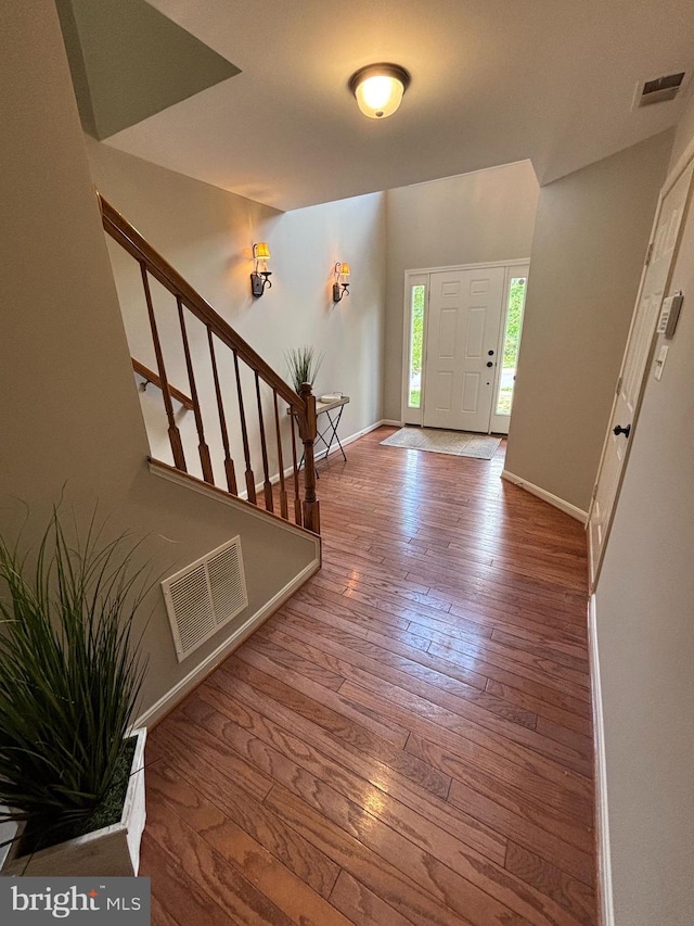 6733 Emmanuel Ct, Gainesville, VA 20155 - entrance foyer with hardwood / wood-style flooring, baseboards, and stairs