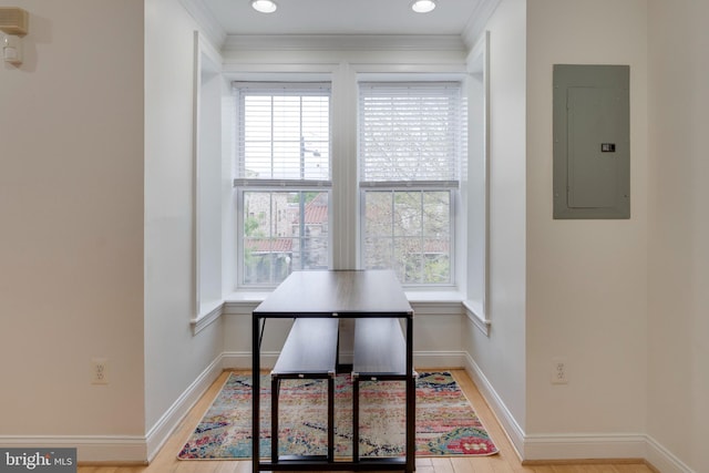office featuring electric panel, baseboards, and ornamental molding
