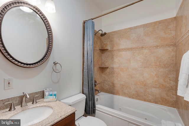 bathroom with toilet, vanity, and a combined bath / shower with jetted tub