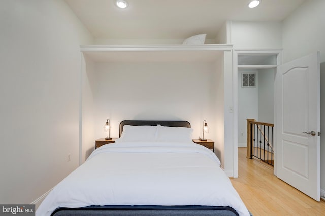 bedroom featuring recessed lighting and light wood-style floors