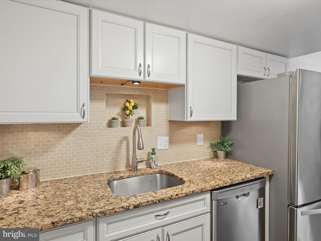 6558 Gildar St, Alexandria, VA 22310 - kitchen with stainless steel appliances, a sink, white cabinets, and tasteful backsplash