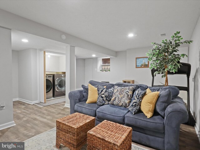 6558 Gildar St, Alexandria, VA 22310 - living area featuring washing machine and dryer, wood finished floors, recessed lighting, and baseboards