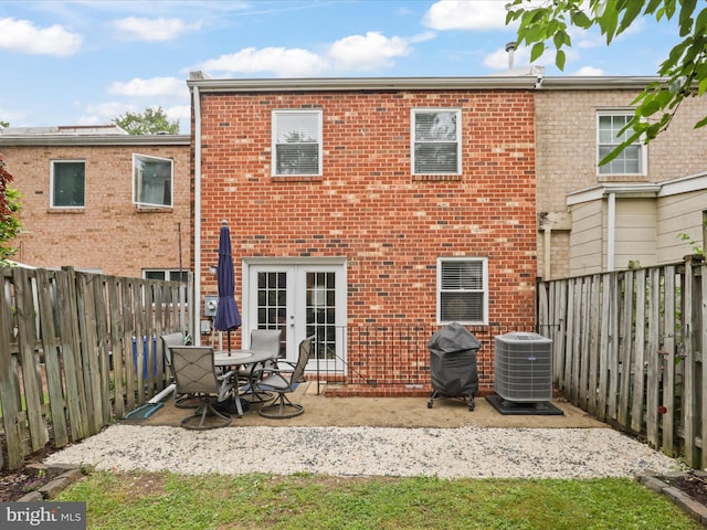6558 Gildar St, Alexandria, VA 22310 - rear view of property with central AC unit, french doors, brick siding, a patio area, and a fenced backyard