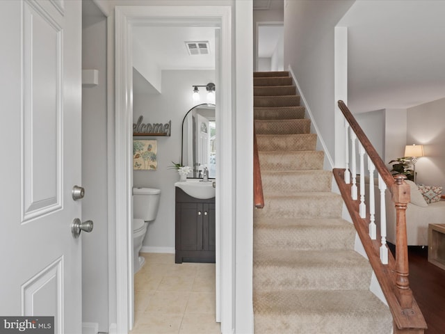 6558 Gildar St, Alexandria, VA 22310 - staircase with baseboards and tile patterned flooring