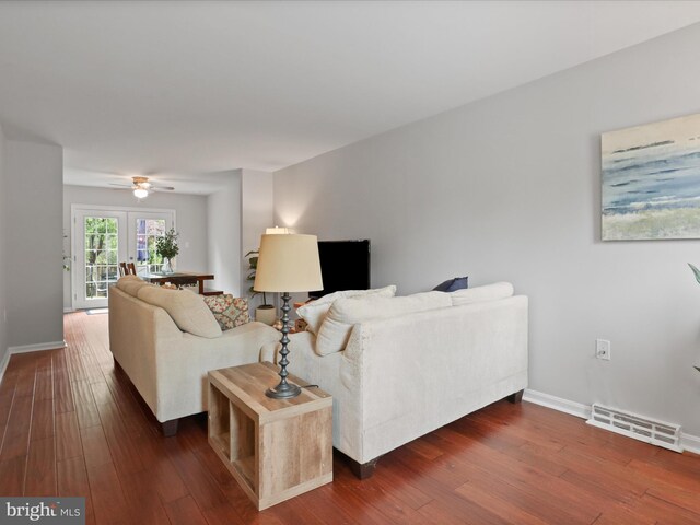 6558 Gildar St, Alexandria, VA 22310 - living area with dark wood-style flooring, baseboards, and a ceiling fan