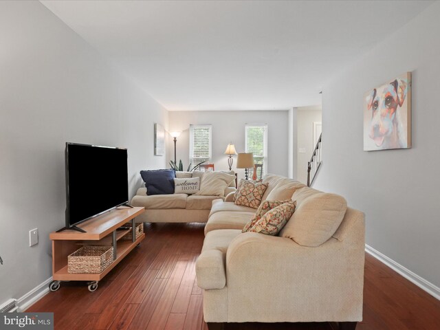 6558 Gildar St, Alexandria, VA 22310 - living room with dark wood-style floors, baseboards, and stairs