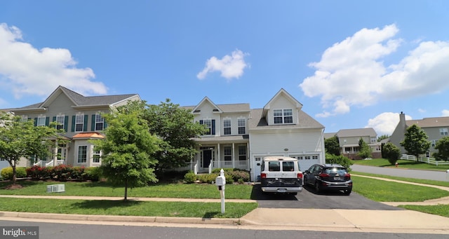 17365 Tedler Cir, Round Hill, VA 20141 - traditional-style house with asphalt driveway, a front yard, and a garage