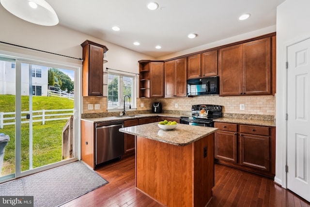 17365 Tedler Cir, Round Hill, VA 20141 - kitchen with black appliances, a sink, open shelves, dark wood-style floors, and light stone counters