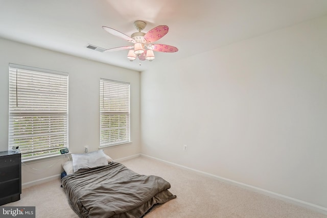 17365 Tedler Cir, Round Hill, VA 20141 - carpeted bedroom featuring multiple windows, baseboards, and a ceiling fan