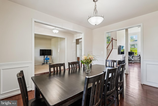 17365 Tedler Cir, Round Hill, VA 20141 - dining space with a wainscoted wall, stairway, and dark wood-type flooring