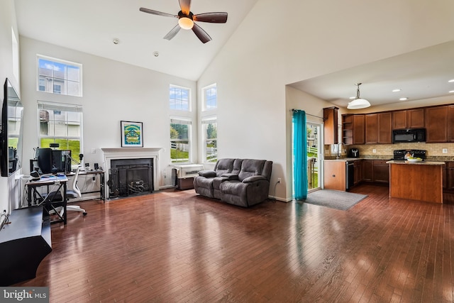 17365 Tedler Cir, Round Hill, VA 20141 - living area with high vaulted ceiling, ceiling fan, healthy amount of natural light, dark wood-type flooring, and a desk