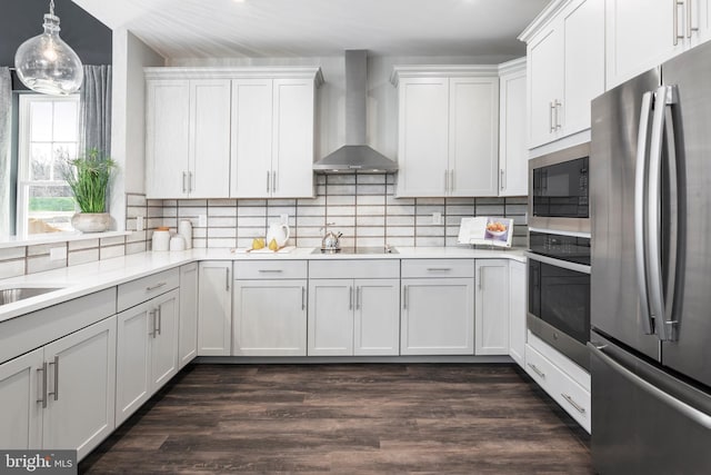 204 Baldy Ln Cayot, Unit Cayot, Middletown, DE 19709 - kitchen with black appliances, wall chimney range hood, light countertops, and decorative backsplash
