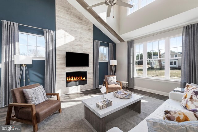 204 Baldy Ln Cayot, Unit Cayot, Middletown, DE 19709 - living area featuring a towering ceiling, a tile fireplace, baseboards, ceiling fan, and wood finished floors