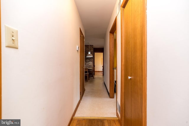 corridor featuring light wood-style flooring