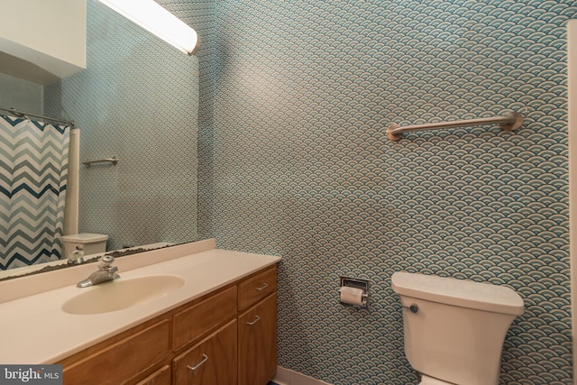 full bath featuring toilet and vanity