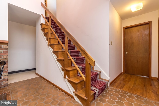 stairs featuring baseboards