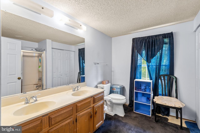 12916 New Hampshire Ave, Silver Spring, MD 20904 - bathroom with a textured ceiling, double vanity, and a shower