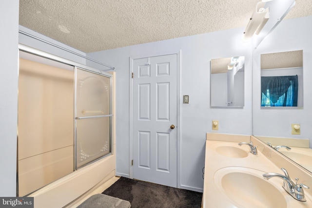 12916 New Hampshire Ave, Silver Spring, MD 20904 - bathroom with a textured ceiling, shower / bath combination with glass door, and double vanity