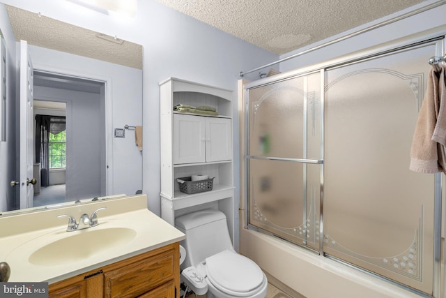 12916 New Hampshire Ave, Silver Spring, MD 20904 - bathroom featuring a textured ceiling, bath / shower combo with glass door, and vanity