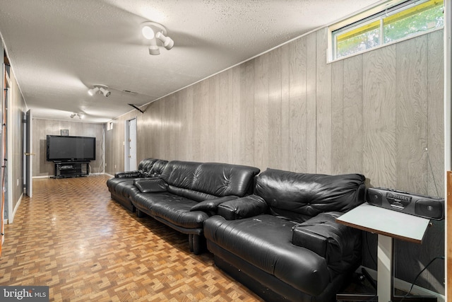 12916 New Hampshire Ave, Silver Spring, MD 20904 - living area featuring wooden walls and a textured ceiling