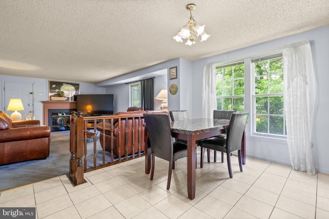 12916 New Hampshire Ave, Silver Spring, MD 20904 - dining space with a textured ceiling, a chandelier, plenty of natural light, and light tile patterned floors