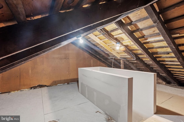 attic featuring an upstairs landing