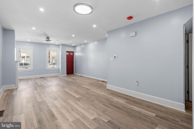 unfurnished living room featuring light wood-type flooring, baseboards, recessed lighting, visible vents, and a ceiling fan