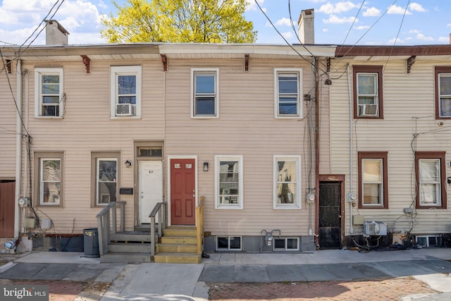 multi unit property with a chimney and cooling unit